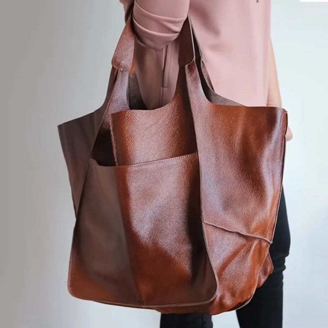 Stylish women's work bag: an oversized vegan leather tote with ample space.