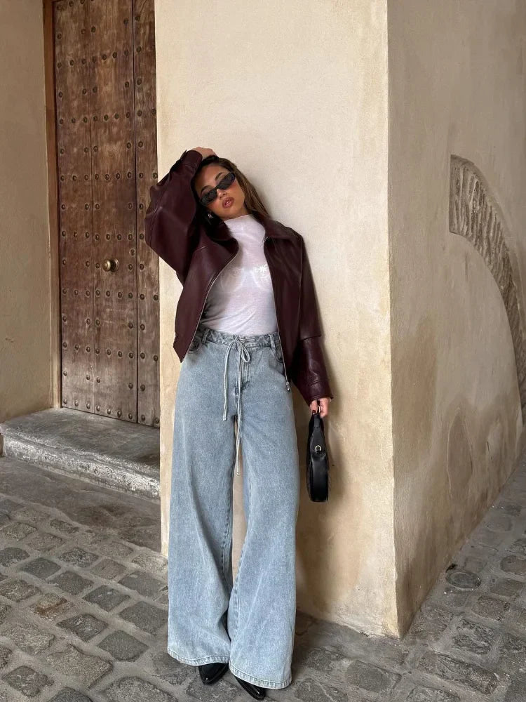 Stylish women's leather jacket, oversized fit, waist-length, for an edgy look