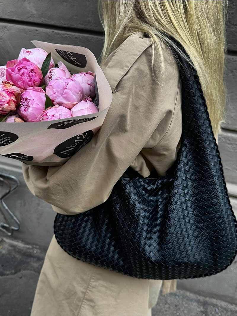 Stylish hobo bag for women, large & woven, ideal for everyday and travel.
