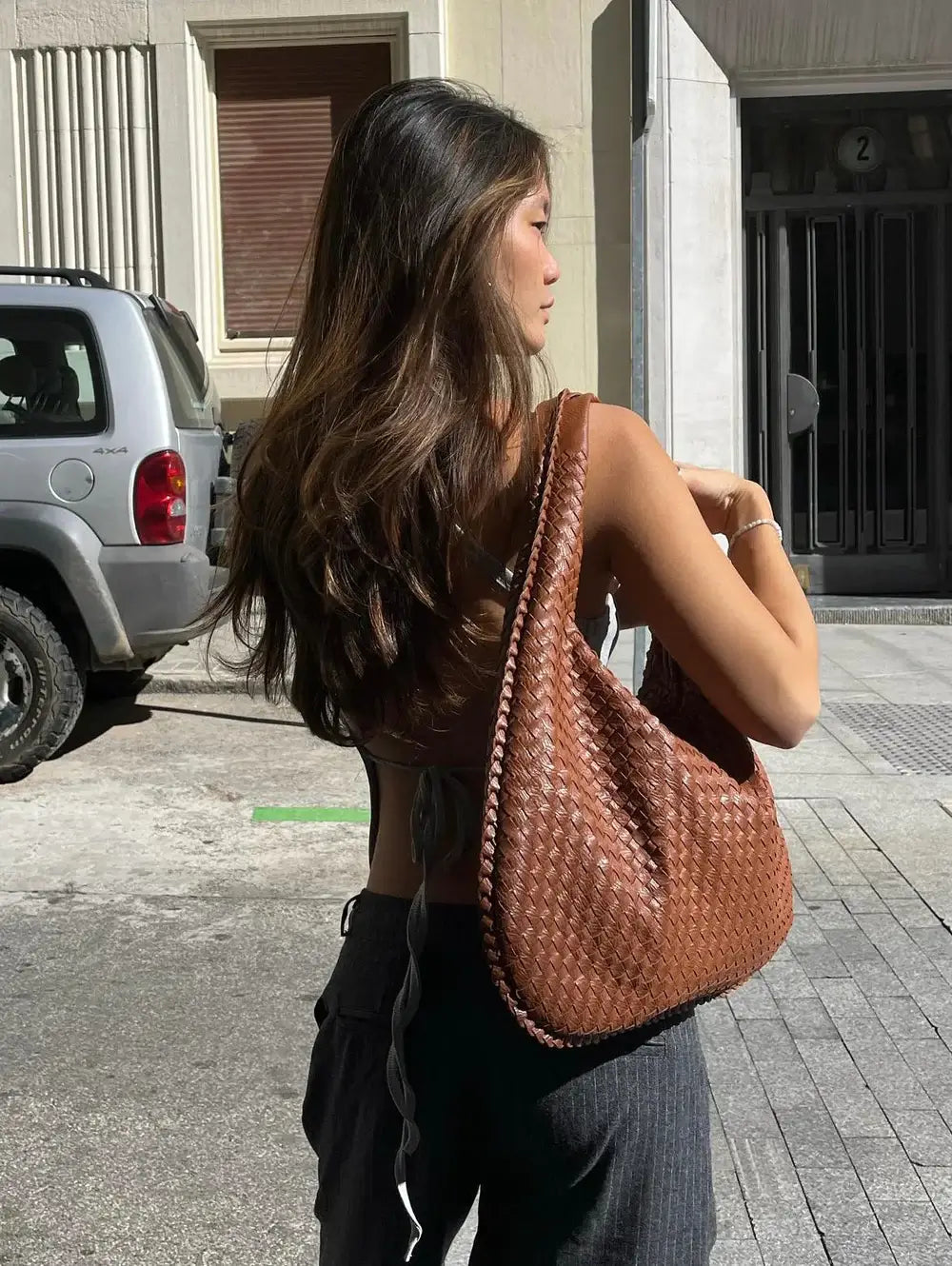 Travel-ready spacious tote, woven & oversized, a stylish option for women.