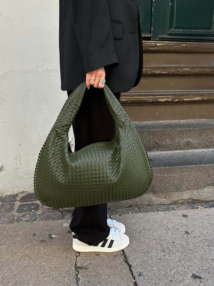 Stylish minimalist hobo bag, woven texture, large capacity for women's needs.