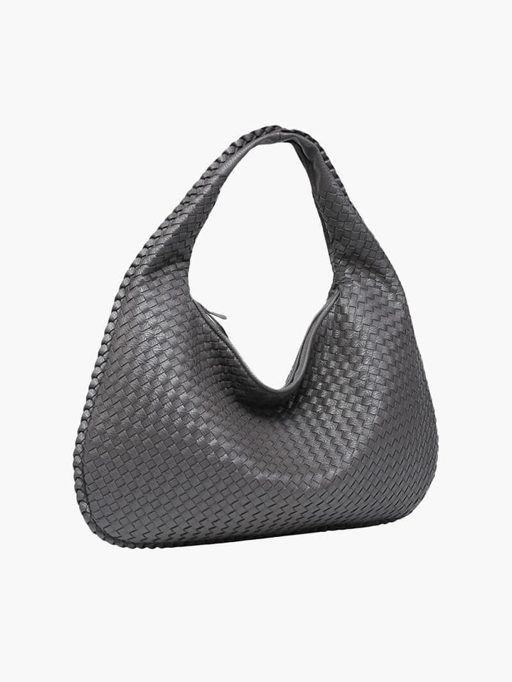 Large woven handbag for women, spacious, practical, and minimalist style.
