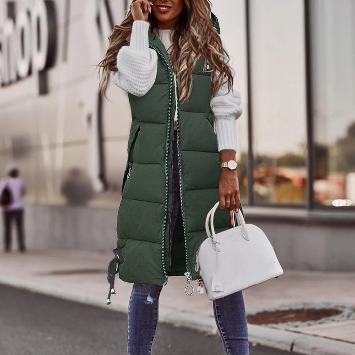 Stylish women's padded vest with hood, perfect for everyday comfort & warmth in cool weather layering.