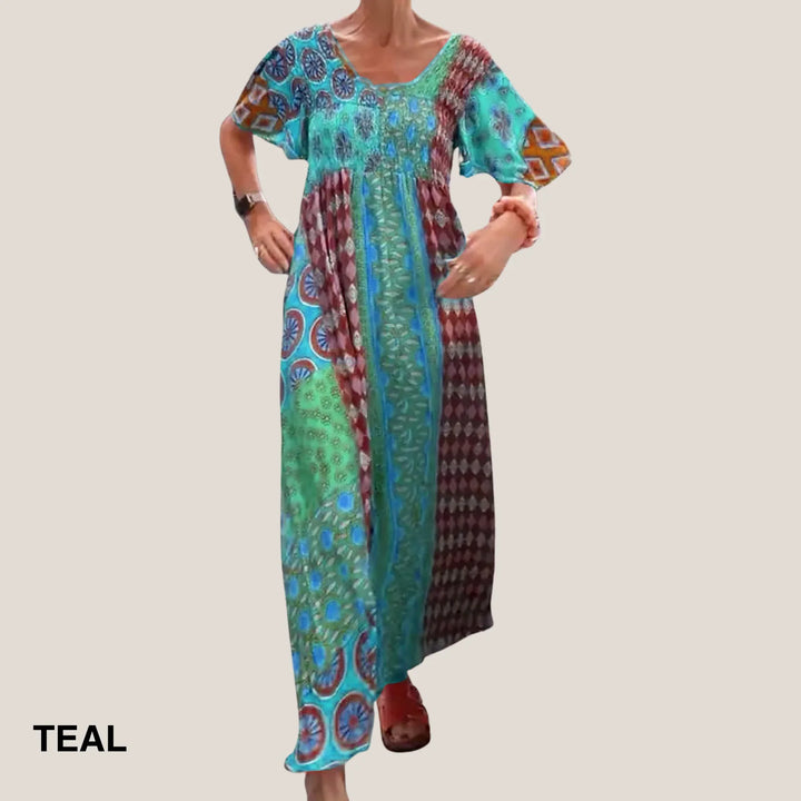 Stylish women's patchwork midi dress. Features a flattering V-neck, short sleeves, and comfortable smocked waist design.