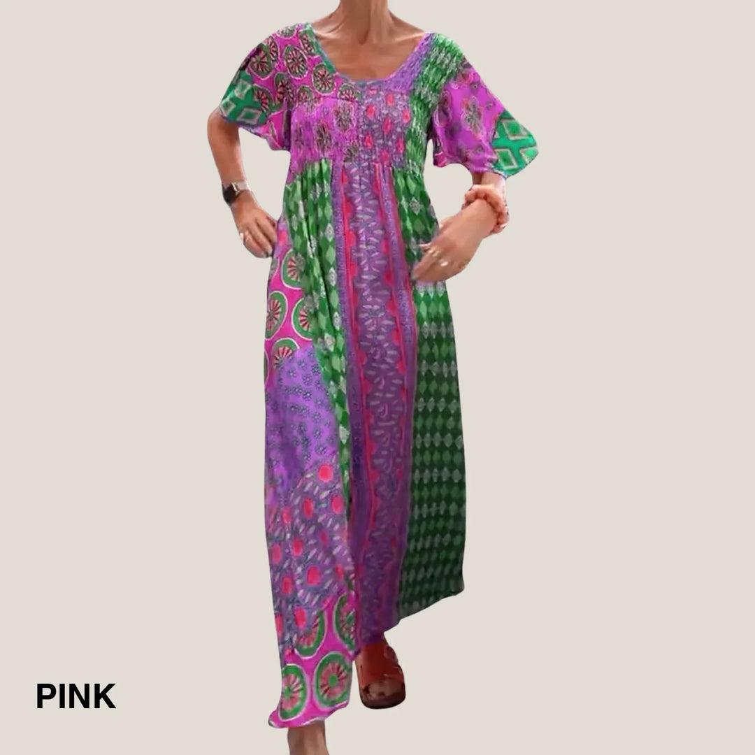 Elegant yet casual women's midi dress. Paisley patchwork print, V-neck, short sleeves, and a comfortable smocked waist.