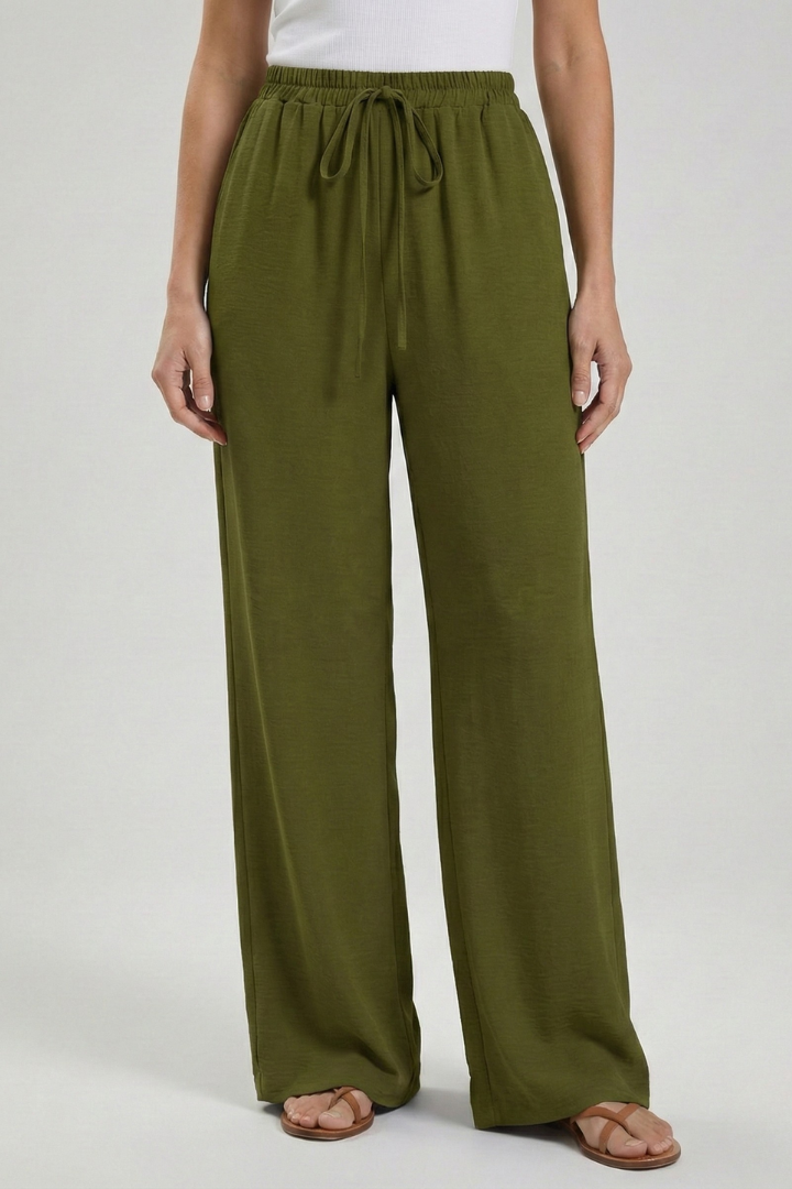 Women's palazzo trousers with spacious side pockets. Wide-leg, flowy, and a comfortable drawstring waist.