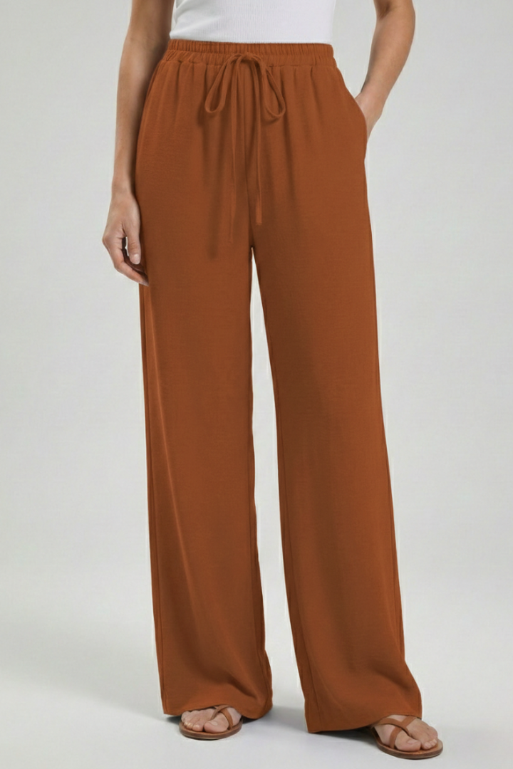 Adjustable drawstring waist on these women's palazzo trousers. Wide-leg, flowy, and comfy with pockets.