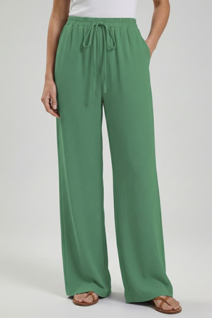 Relaxed fit women's palazzo trousers. Wide-leg, flowy summer pants with drawstring waist & side pockets.