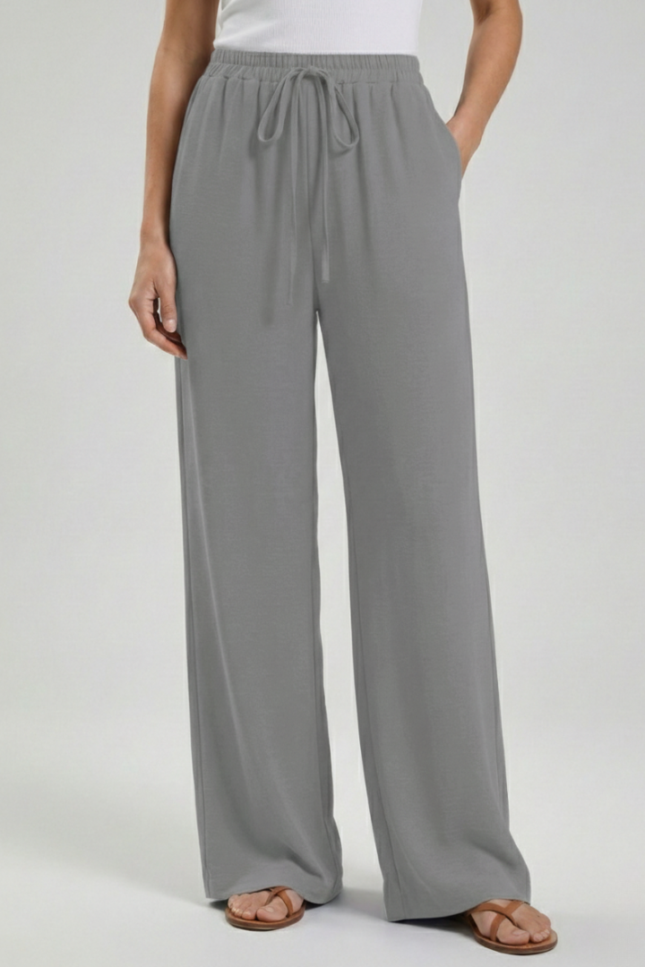 Women's comfortable wide-leg palazzo trousers, perfect for summer. Features a drawstring waist and side pockets.