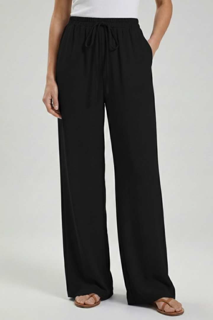 Light & airy women's palazzo trousers. Flowy wide-leg design, comfortable drawstring waist & side pockets.