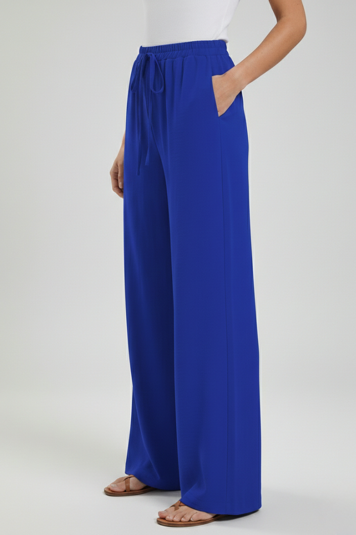 Women's wide-leg palazzo trousers featuring a comfy drawstring waist & practical side pockets.