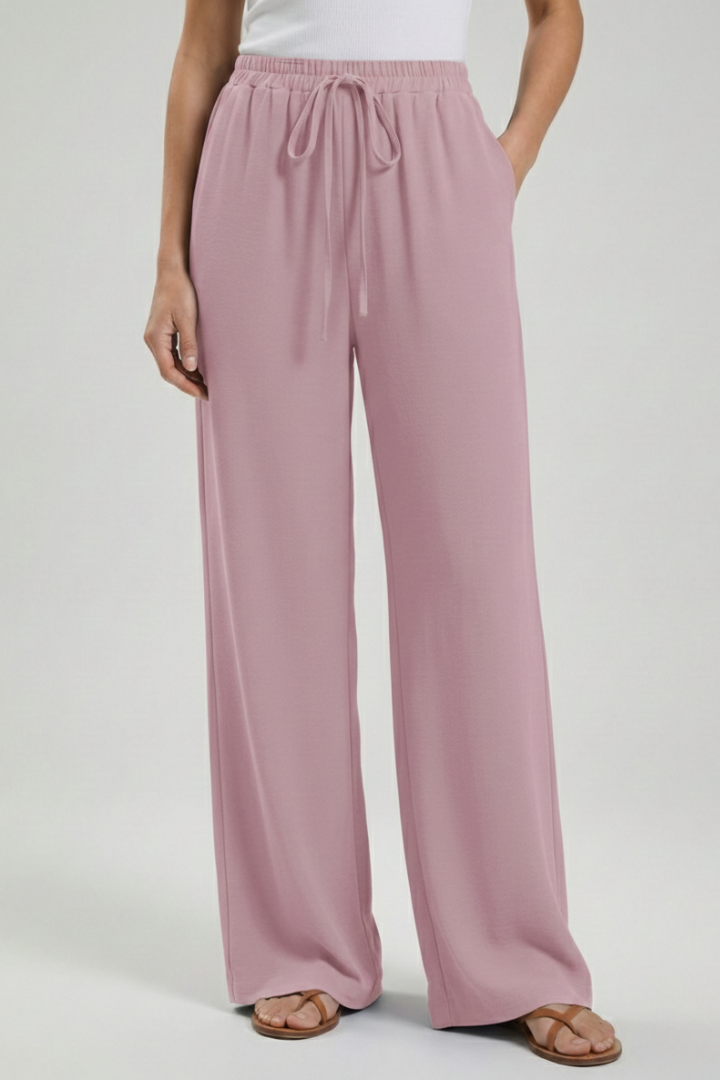 Elegant women's wide-leg palazzo trousers. Comfortable summer pants with drawstring waist, pockets.