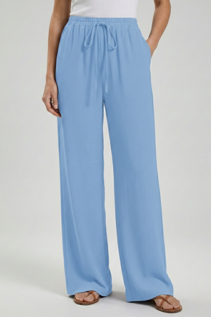 Soft, comfortable women's palazzo trousers. Flowy wide-leg design with drawstring waist and side pockets.