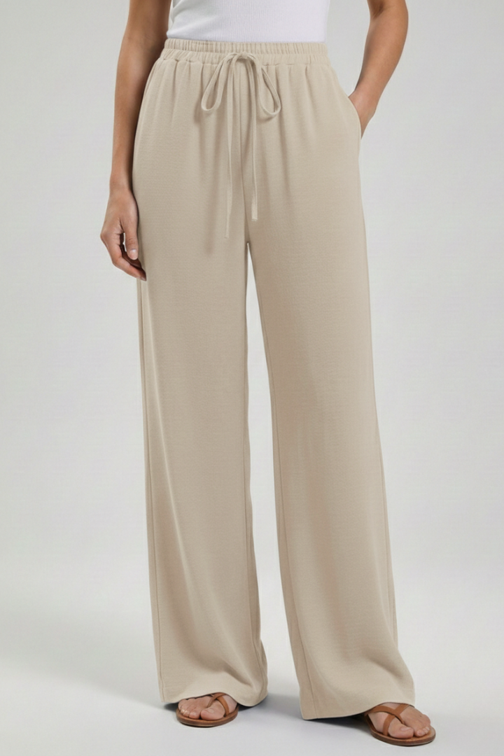 Versatile women's palazzo trousers. Casual wide-leg summer pants with a comfortable drawstring waist & pockets.