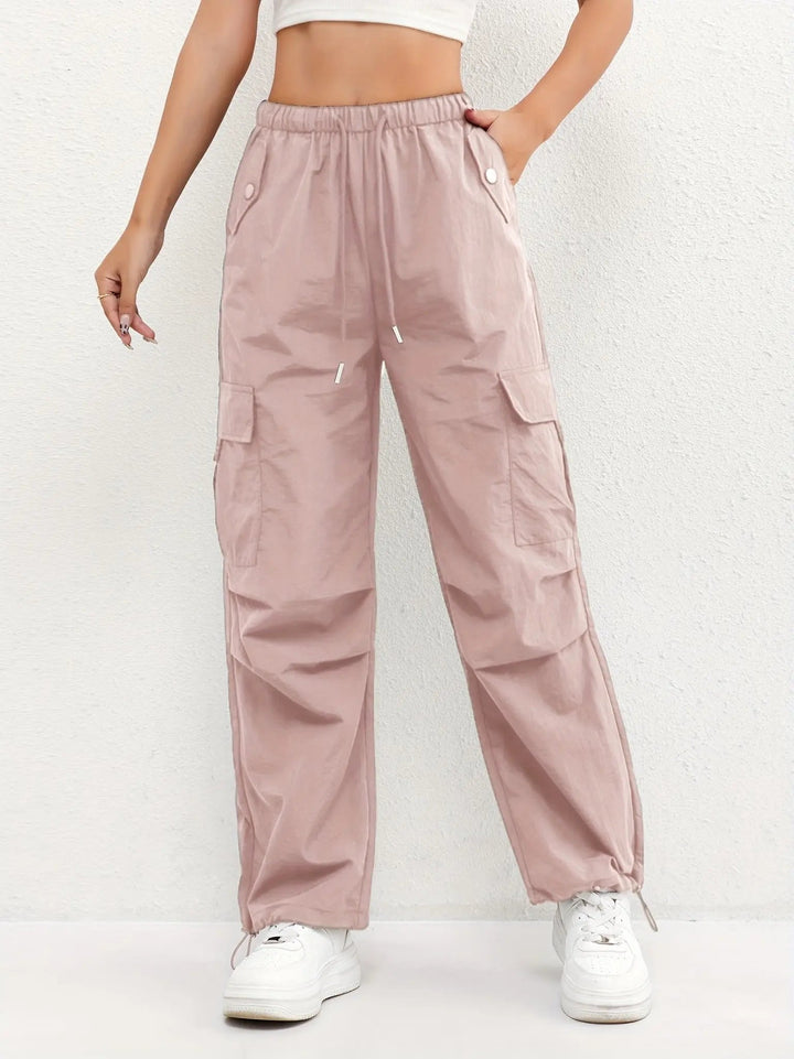 Women's parachute cargo trousers with drawstring waist & relaxed fit, perfect for streetwear style.