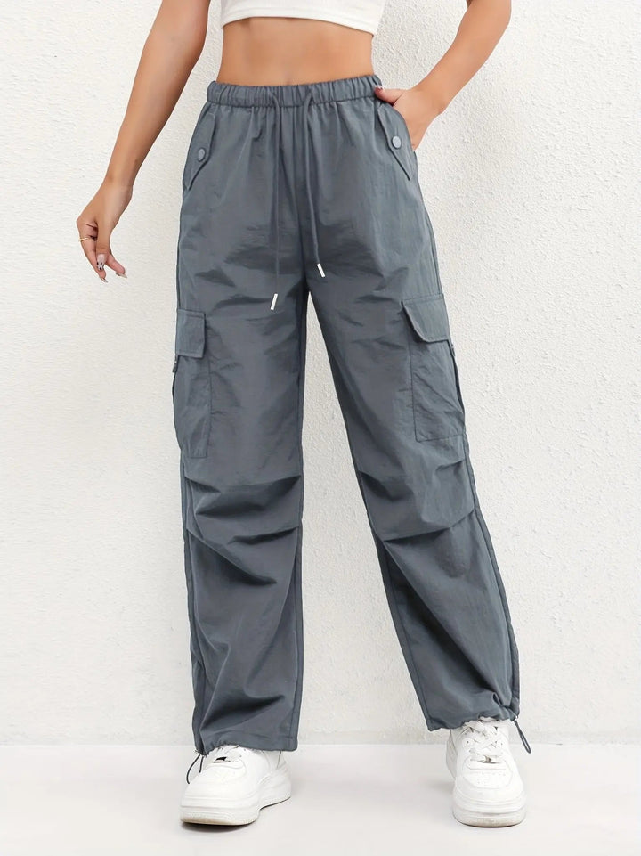 Women's drawstring waist parachute cargo trousers, ideal for casual fashion with adjustable hem detail.