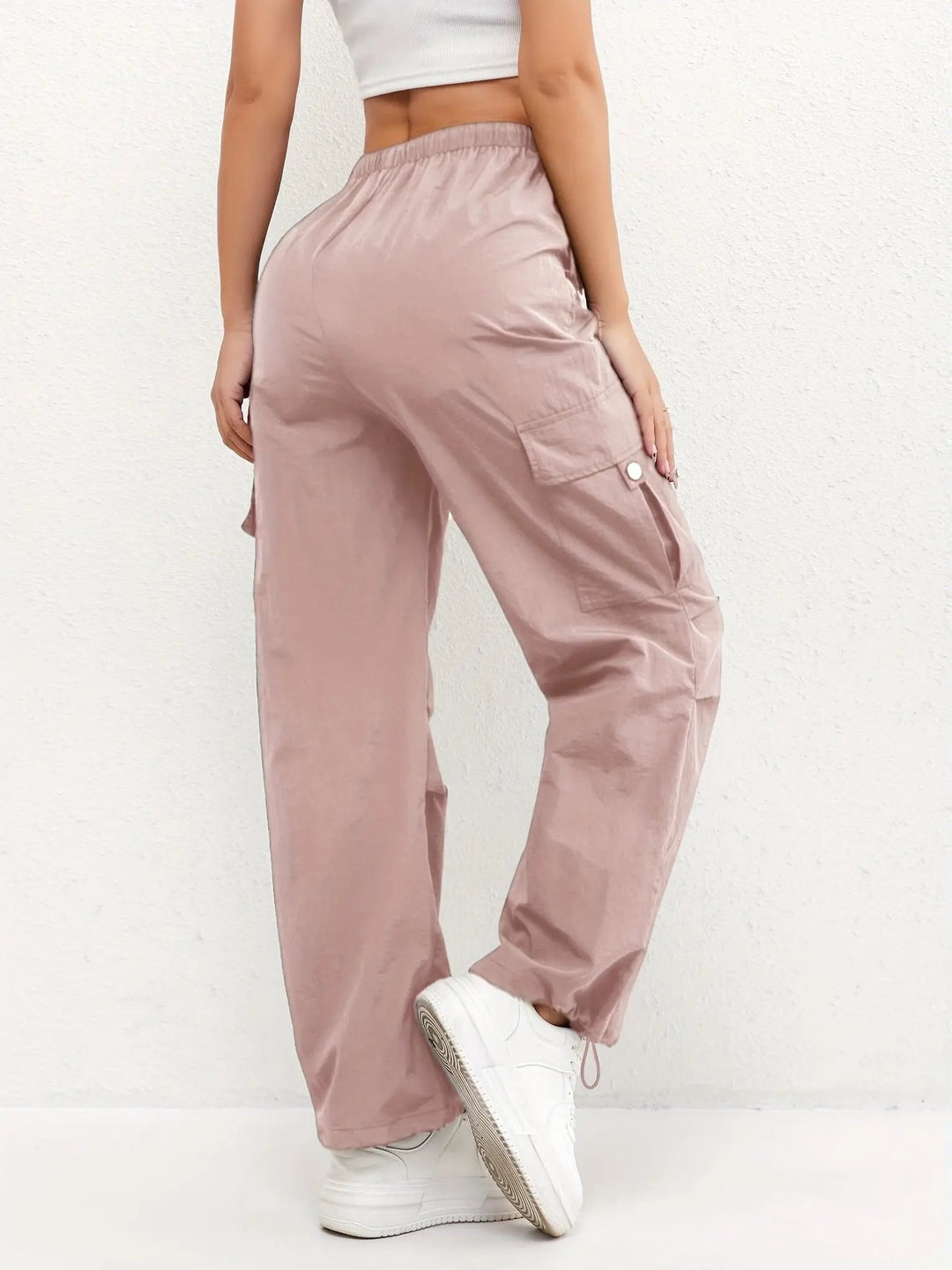 Versatile women's parachute cargo trousers, ideal casual bottoms with adjustable hem and drawstring waist.