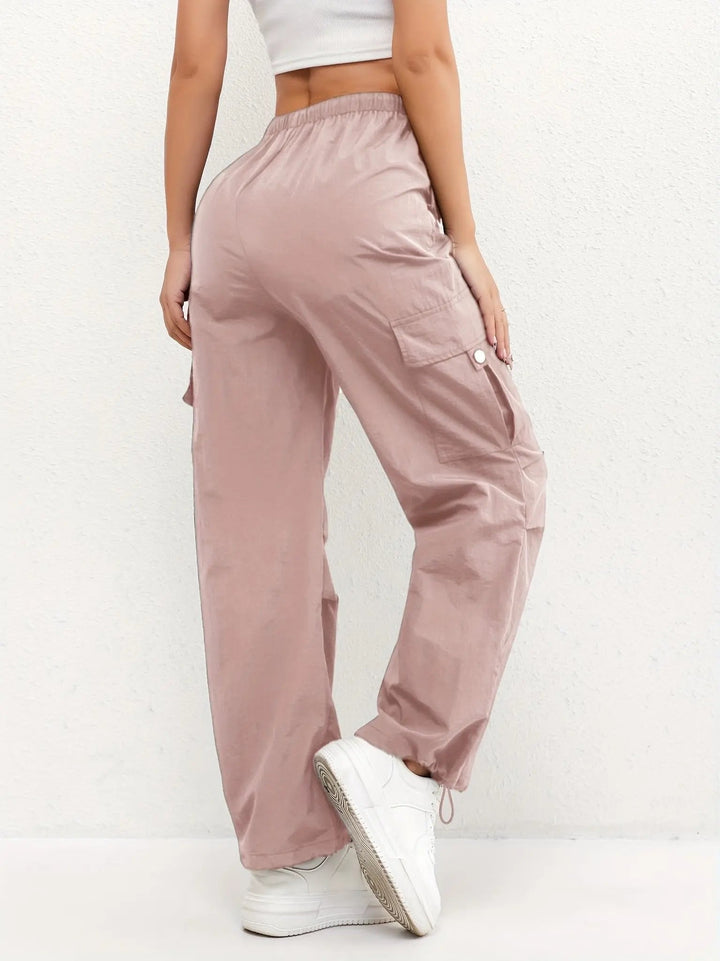 Versatile women's parachute cargo trousers, ideal casual bottoms with adjustable hem and drawstring waist.