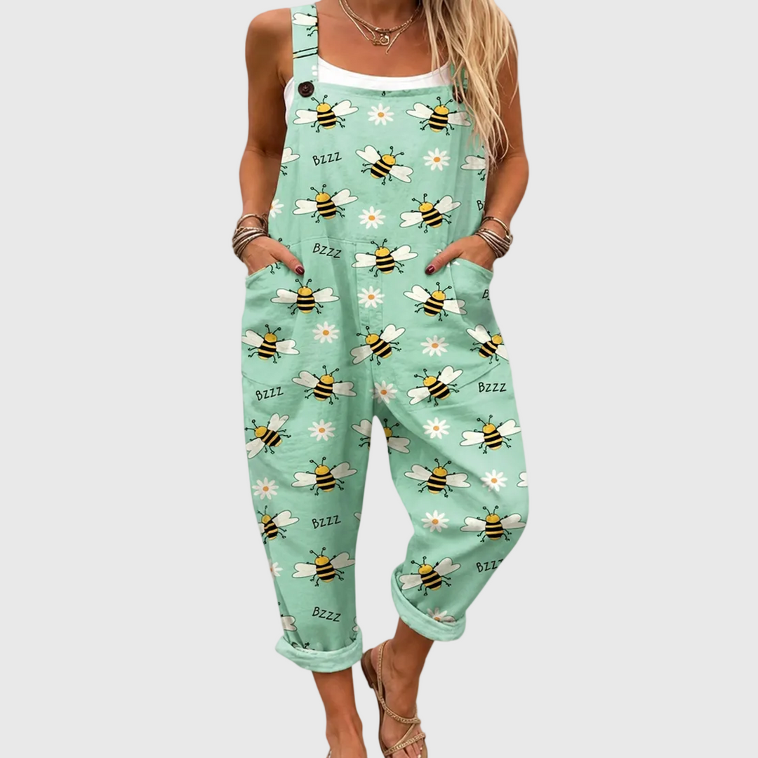 Women's pastel green daisy bee floral print jumpsuit. Comfortable casual one-piece for stylish summer fashion.
