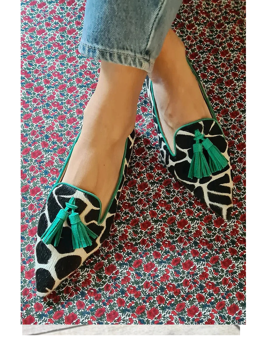 Women's patterned slip-on loafers with elegant tassel detail, perfect for casual or fashion wear.