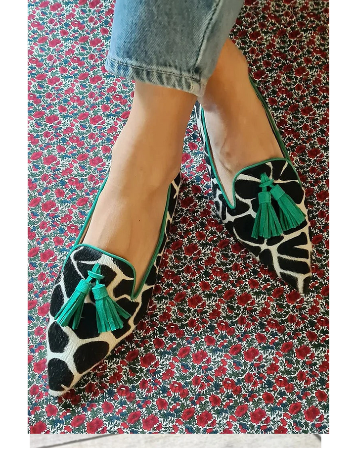 Women's patterned slip-on loafers with elegant tassel detail, perfect for casual or fashion wear.