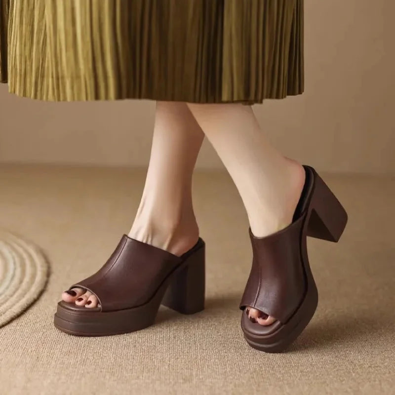 Women's peep-toe platform mule sandals with a stylish block heel. Elegant summer footwear.