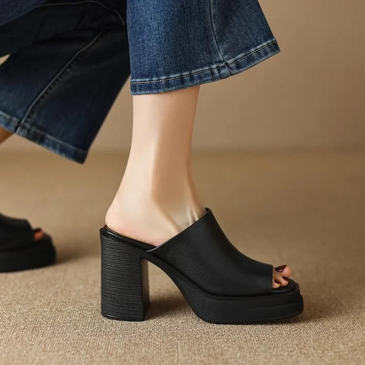 Fashionable women's peep-toe platform mule sandals with a robust block heel, perfect for spring/summer.