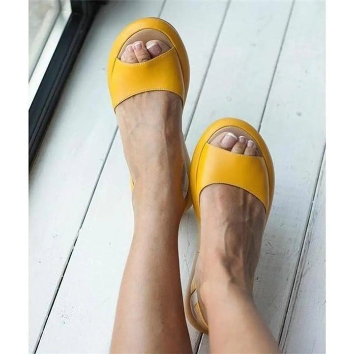 Essential women's peep toe slingback flat sandals, comfortable & cushioned for warm weather.