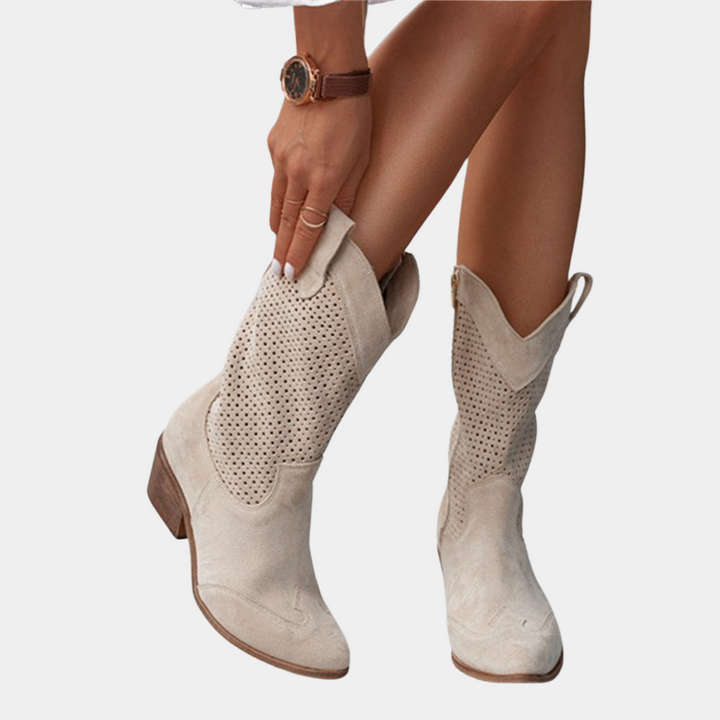 Versatile women's mid-calf boots with a sturdy block heel and perforated texture, great for modern casual looks.