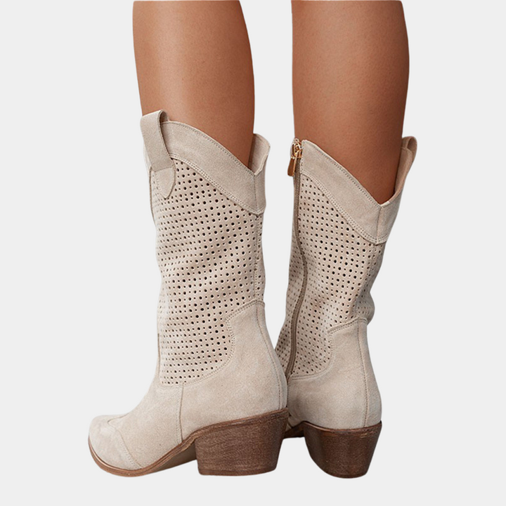 Trendy women's perforated mid-calf boots, combining a comfortable block heel with unique stylish detailing.
