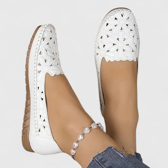 Beige women's perforated slip-on flats. Versatile, breathable everyday shoes for smart casual style.
