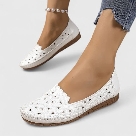 Spring/Summer women's perforated slip-on flats. Breathable, comfortable closed-toe casual shoes.