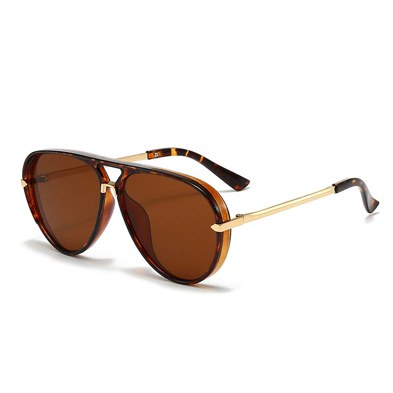 Contemporary women's aviator sunglasses, black frame, offering superior UV eye protection.