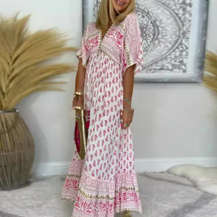 Women's pink boho print maxi dress with V-neck & short sleeves, perfect for casual summer or spring wear.