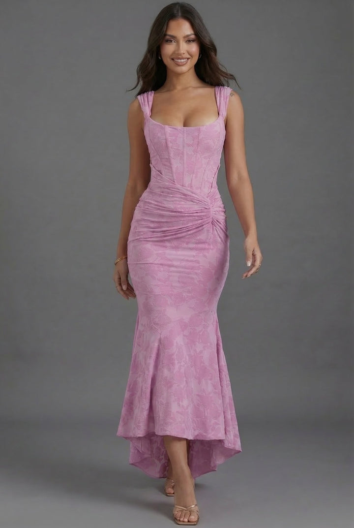 Special occasion pink ruched maxi dress with a stylish corset top and a sophisticated fishtail hem.