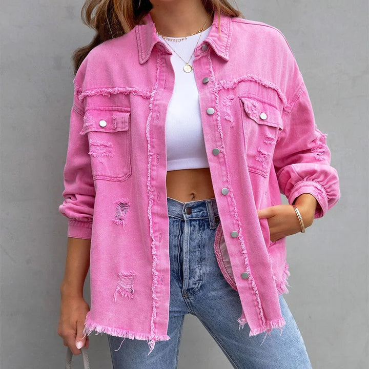 Women's pink distressed denim jacket with frayed hem and button-up front, perfect for casual spring fashion.