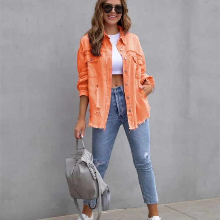 Women's casual pink distressed denim jacket with trendy frayed hem. Button-up design for easy layered styling.