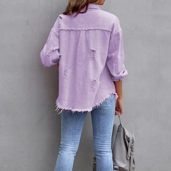 Trendy women's pink distressed button-up denim jacket with frayed edges, great for casual spring/fall fashion.