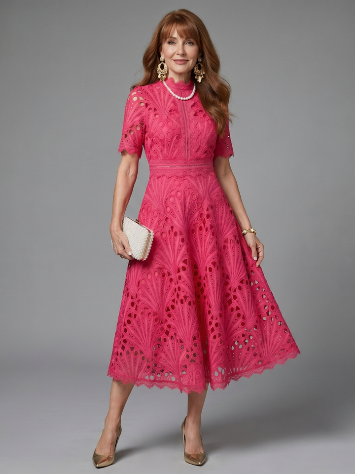 Women's pink eyelet lace midi dress, short sleeve with a fitted waist, perfect for summer fashion.