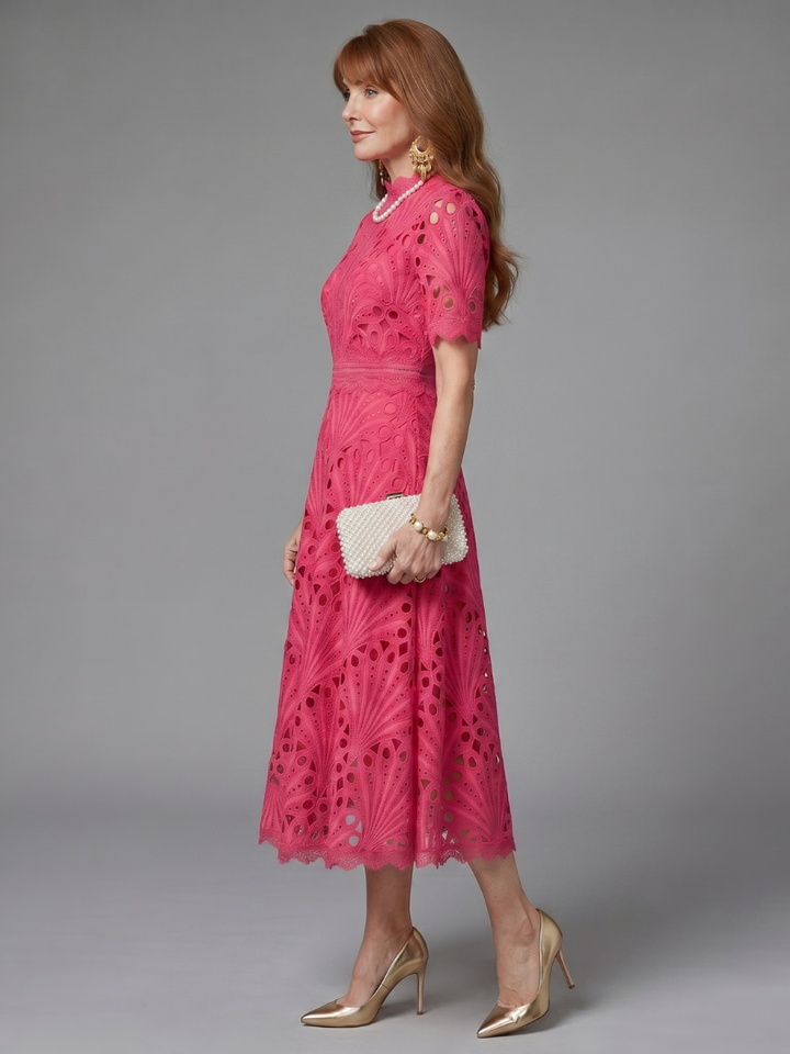 Elegant women's short sleeve pink eyelet lace midi dress, featuring a flattering fitted waist for chic occasions.