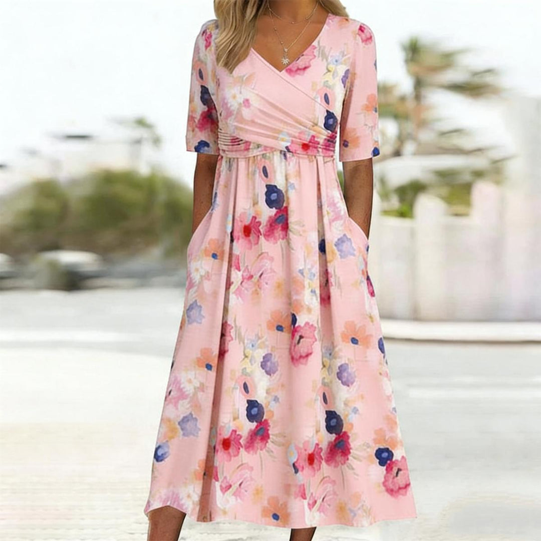 Elegant women's floral midi dress, pink with V-neck & short sleeves. Comfortable casual spring fashion.