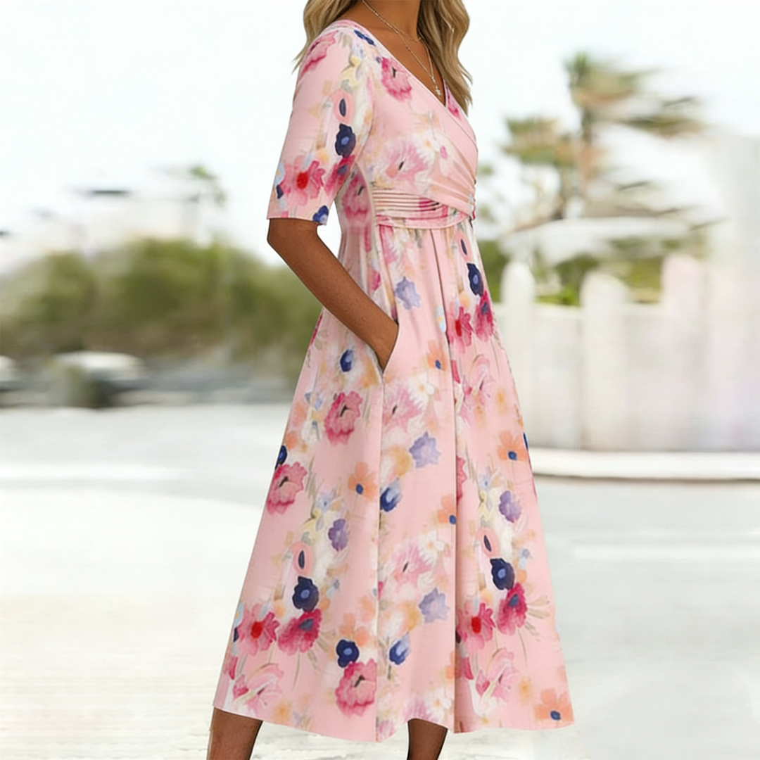 Romantic women's floral print pink midi dress, V-neck, short sleeves, A-line cut, practical side pockets.