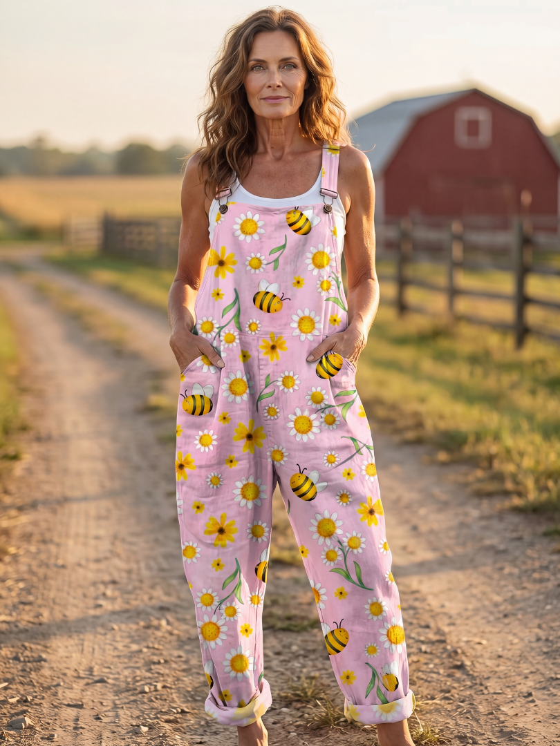 Women's pink floral relaxed jumpsuit with bee print, perfect for comfortable summer day wear.