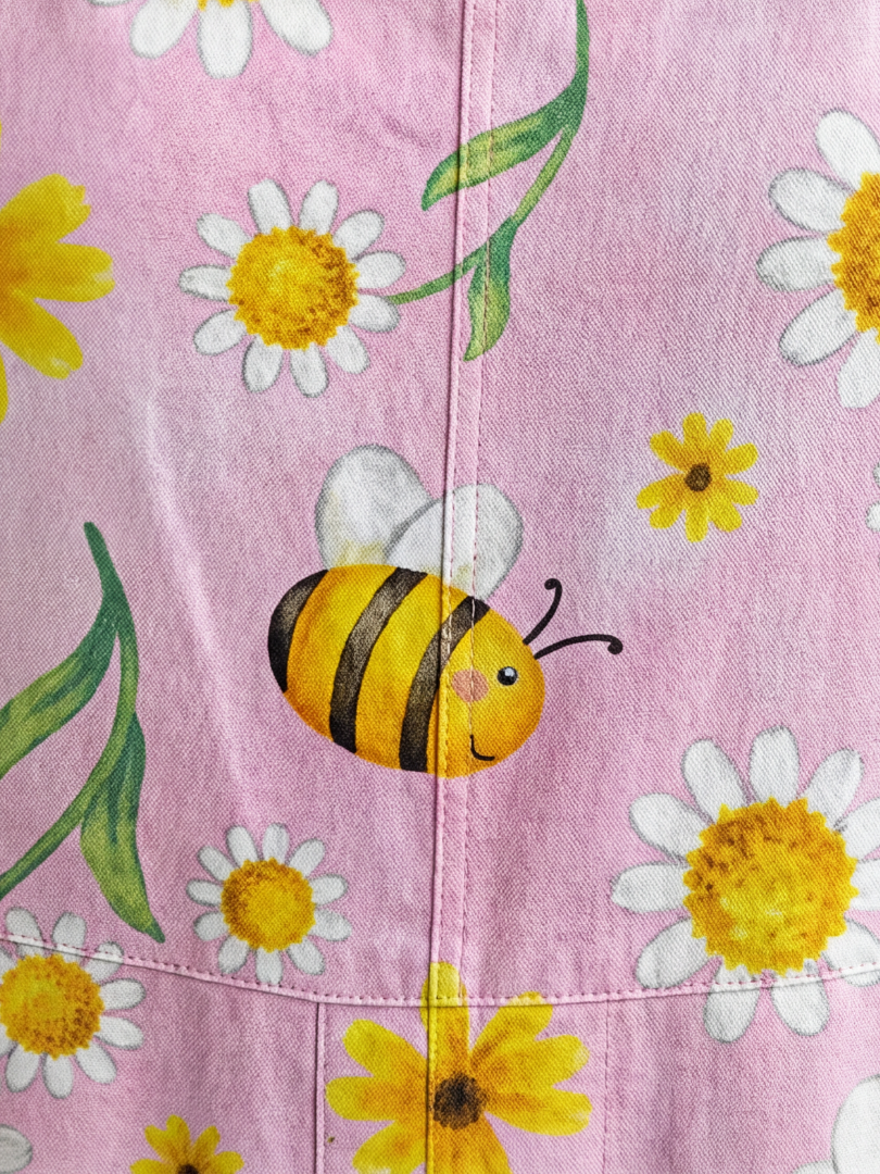 Women's full-length pink floral bloom jumpsuit with bee print, a relaxed fit for casual day wear & summer style.