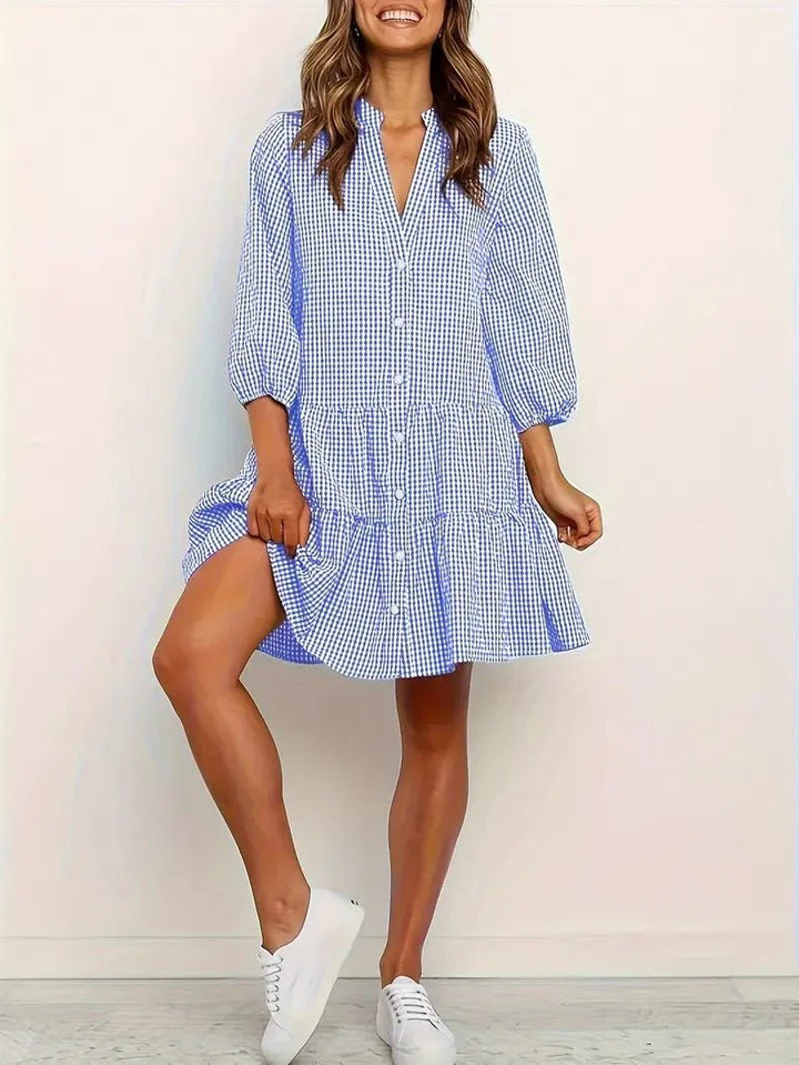 Blue gingham tiered mini dress for women, featuring a V-neck, 3/4 sleeves, and button-down front.