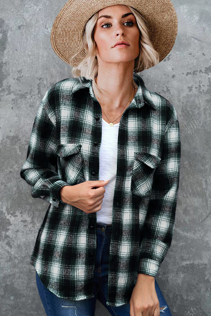Women's plaid button-up shirt jacket with front pockets for casual fall layering.