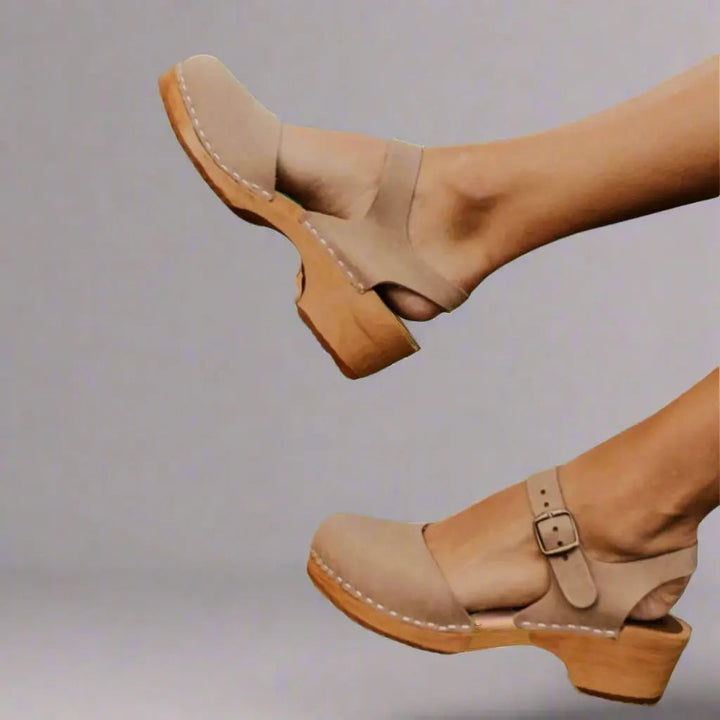 Modern women's platform sandals featuring a low block heel, secure ankle strap, and trendy design.