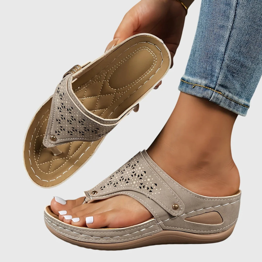 Comfortable & stylish women's platform slip-on sandals. Unique cut-out thong strap adds a chic summer look.