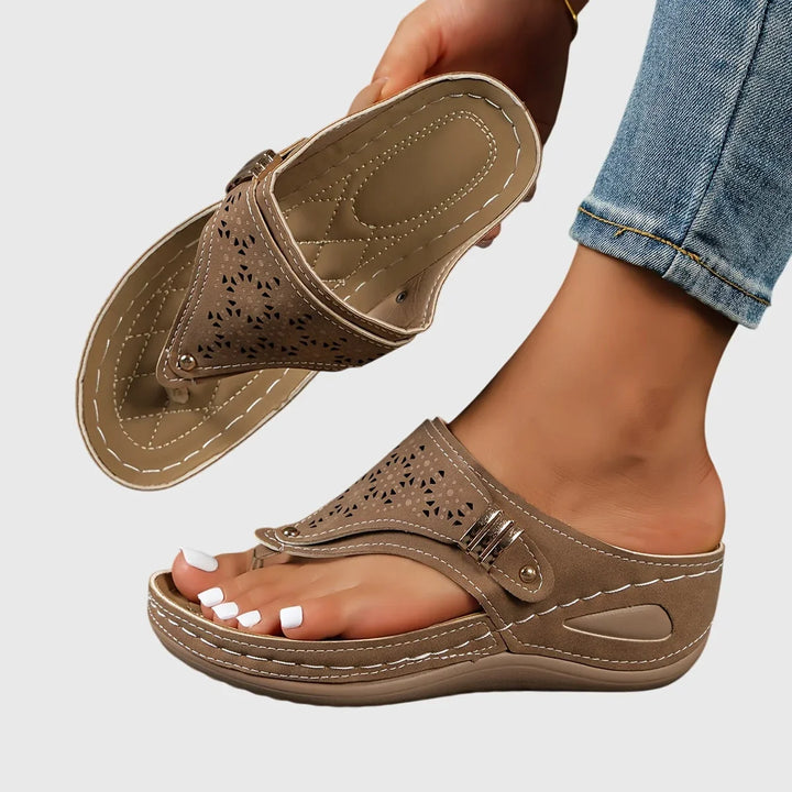 Women's platform slip-on thong sandals. Features a trendy cut-out strap design, ideal for summer.
