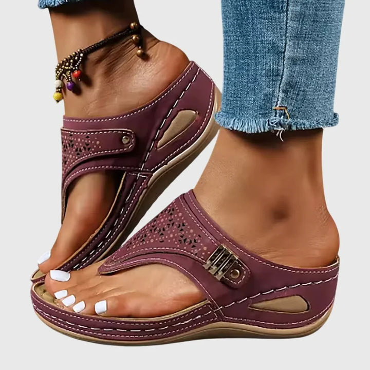 Fashion-forward women's platform sandals. Slip-on style with a unique cut-out thong strap for summer outfits.